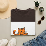 Orange tabby kitten playing line art on white T-shirt