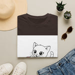 Wide-eyed cat face graphic printed on white T-shirt front